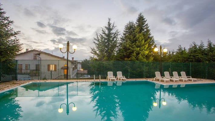 Narconon Astore rehabilitation center in Italy, located in a natural park with swimming pools, tennis court, and spacious outdoor areas for recovery